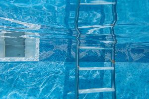 Underwater View In Swimming Pool Of Ladder