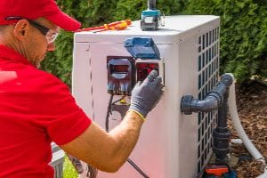 Close Up Of A Technician Fixing A Pool Heater