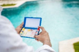 Person Checking Chemicals In A Pool