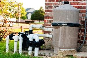 9 Ways You'Re Accidentally Damaging Your Pool Pump 1 A Pool Pump Up Against A Side Wall.